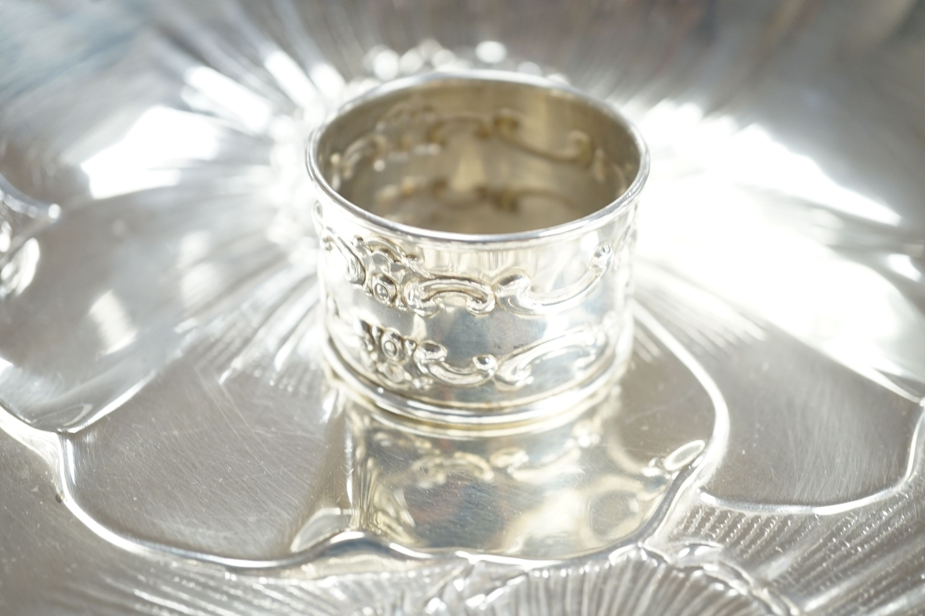 An American sterling embossed fruit bowl by Wallace, diameter 25.4cm and a Gorham sterling napkin ring, 150z.